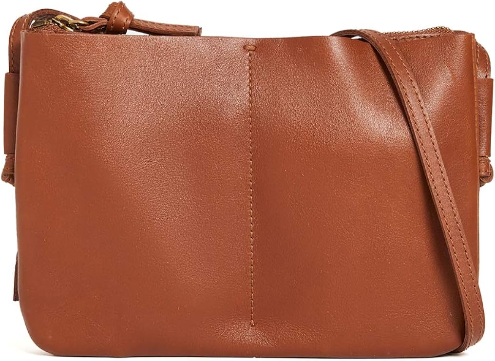 Brown crossbody bag with a front seam and a shoulder strap, shown in its customer photograph