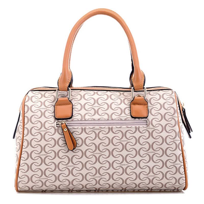 Beige monogram print boston bag with tan leather handles and a front zip pocket
