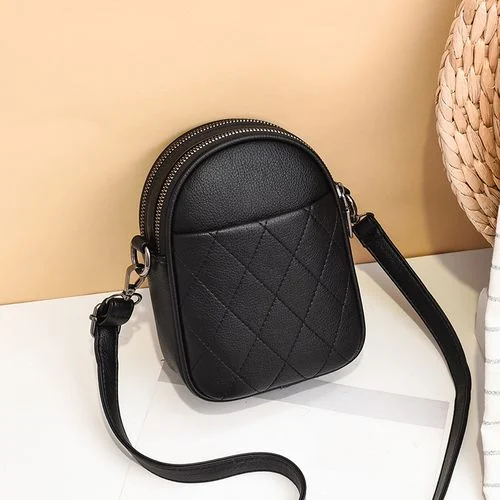 Compact black crossbody bag with a quilted front
