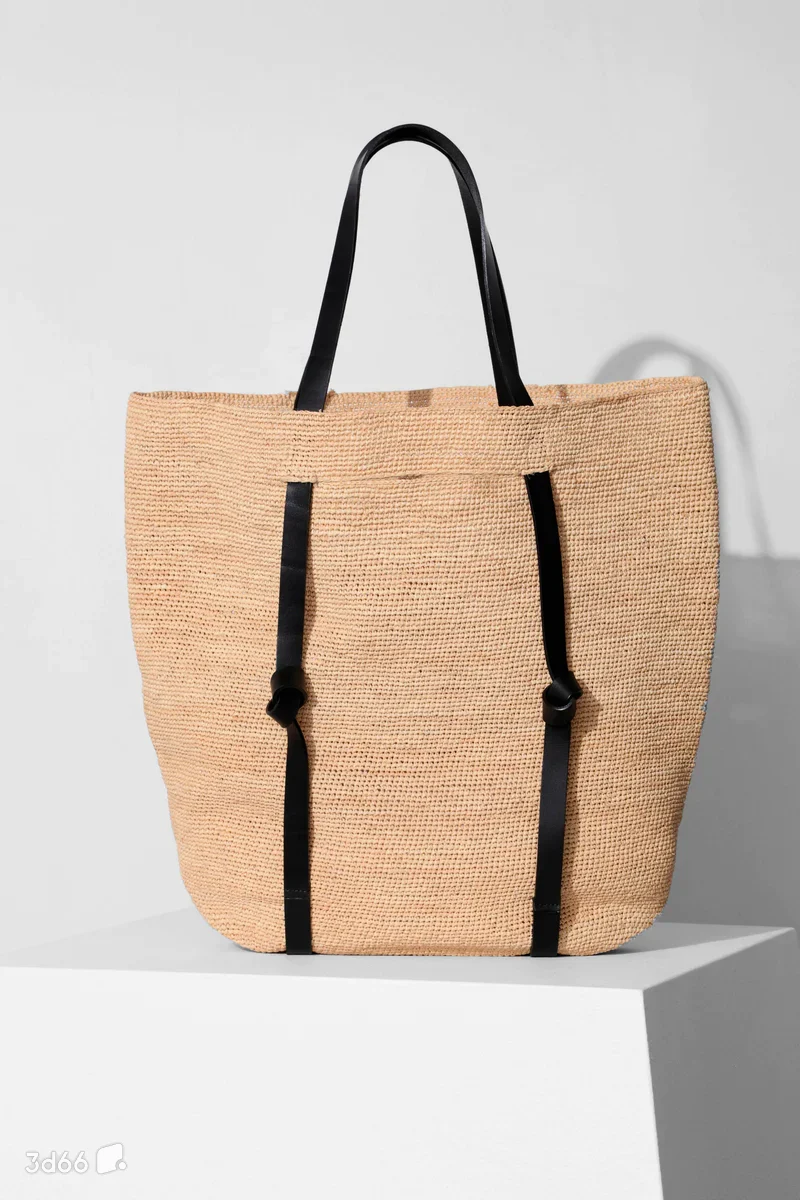 Natural woven tote with long black leather handles and knot details